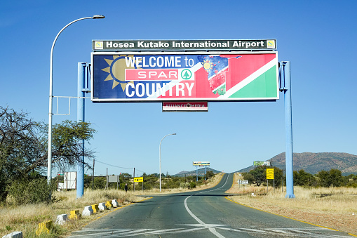 Hosea Kutako International Airport at Windhoek in Khomas Region, Namibia, with a billboard advert for SPAR.