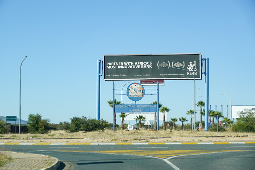 Hosea Kutako International Airport near Windhoek in Khomas Region, Namibia, with an advertising billboard in the background.