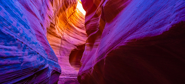 Woman hiking slot canyon