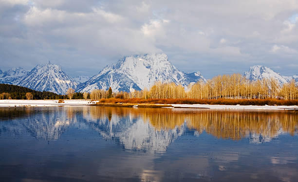 Teton Mountain Range from Oxbow Bend at Sunrise stock photo