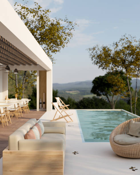 nowoczesny luksusowy hotelowy salon przy basenie z zewnętrznym wystrojem z wygodną sofą, leżakami i basenem - luxury house villa swimming pool zdjęcia i obrazy z banku zdjęć