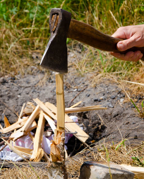 istock chopping wood with an ax for a fire 1404625484
