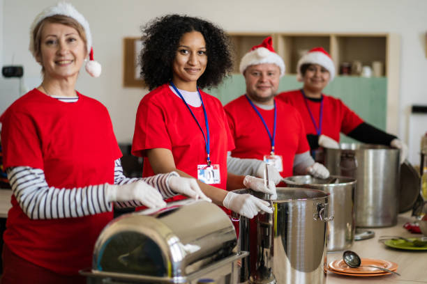istock Volunteers ready to serve in a soup kitchen 1404627440