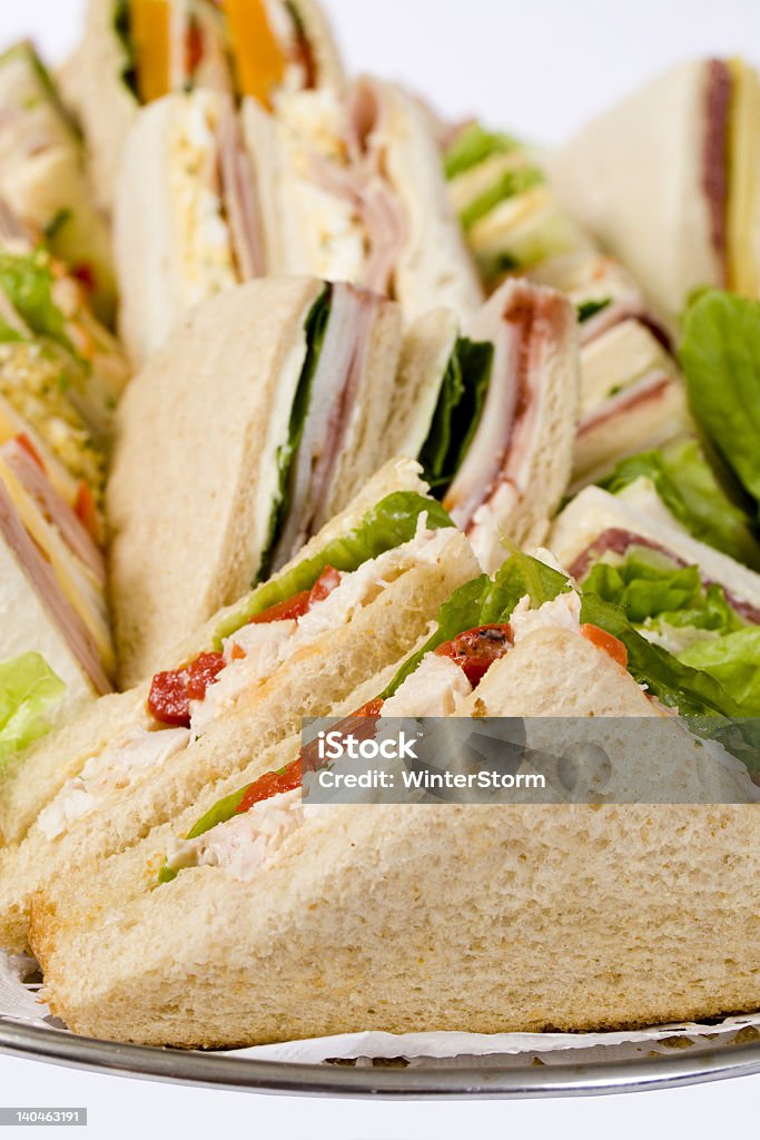 Close-up of triangular sandwiches on a platter Close up shots of assorted sandwich triangles on a catering party platter Sandwich Stock Photo