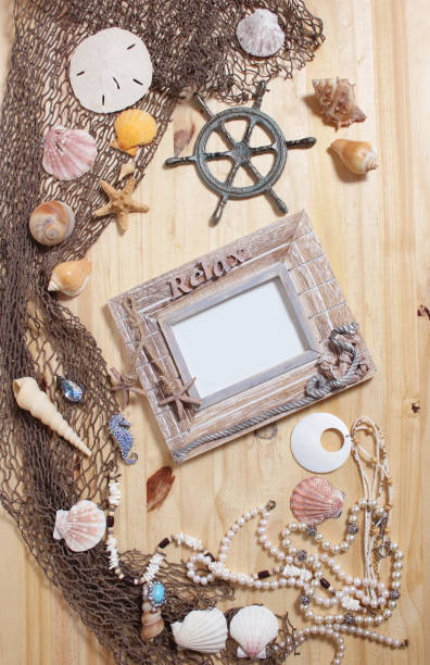 istock Empty Frame on Wooden Background With Sea Shells and Fishing Net. Nautical and Coastal Theme 1404632017