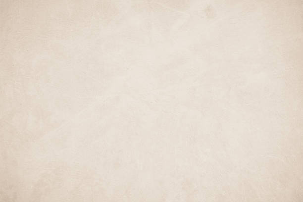 istock Old concrete wall texture background. Close up retro plain beige color cement material surface rough for show or advertise promote product content on display and brown paper design element concept. 1404632134