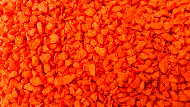 istock A pile of small reddish-orange stones for creating art 1404632359