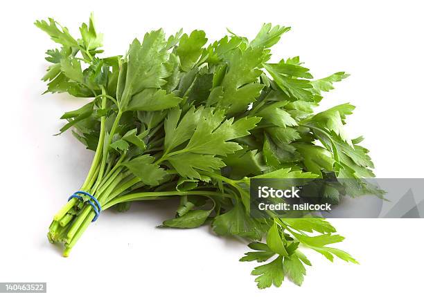 Banded Bunch Of Flat Leaf Parsley On White Background Stock Photo - Download Image Now