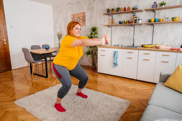 istock Young Overweight Woman Exercising At Home 1404635764