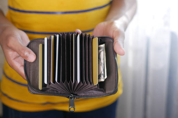 istock man hand taking credit card out from a wallet 1404636989