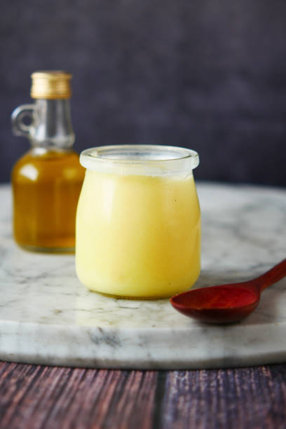 homemade ghee in container on a table , homemade ghee in container on a table ghee stock pictures, royalty-free photos & images
