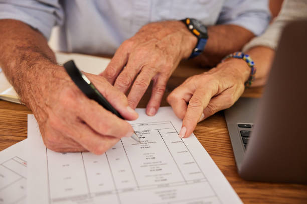 istock Senior couple reading through a medical bill while doing their home finances 1404637783