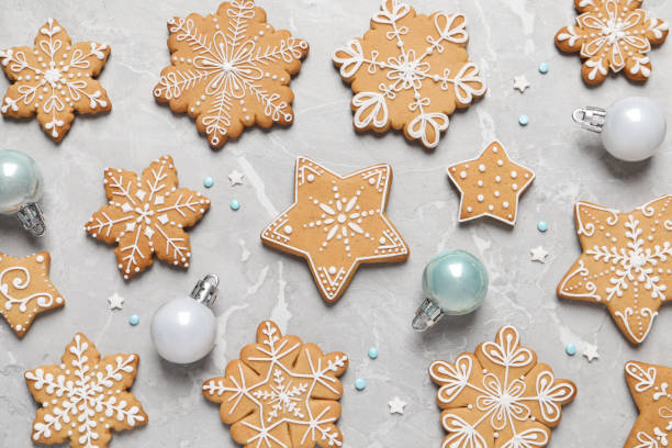 istock Tasty Christmas cookies and baubles on light grey marble table, flat lay 1404639097
