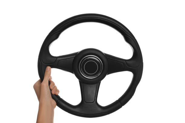 istock Woman with steering wheel on white background, closeup 1404639367