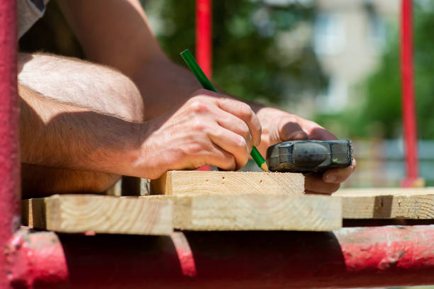 istock worker are engaged in work with wooden boards, close-up 1404639581