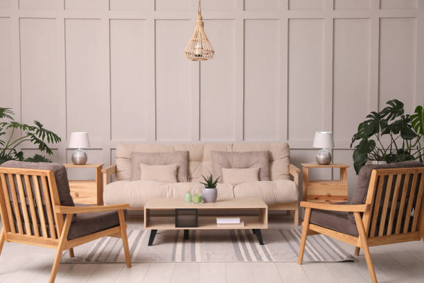 istock Stylish living room interior with comfortable sofa, armchairs and beautiful plants 1404640136