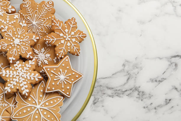 istock Tasty Christmas cookies on white marble table, top view. Space for text 1404640345