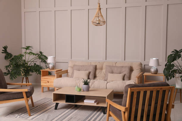 istock Stylish living room interior with comfortable sofa, armchairs and beautiful plants 1404640627