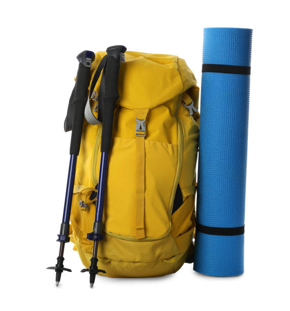 istock Trekking poles, backpack and camping mat on white background 1404640823