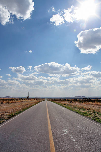 Road on a desert long road on a mexican desert in the north of the contry anyway stock pictures, royalty-free photos & images