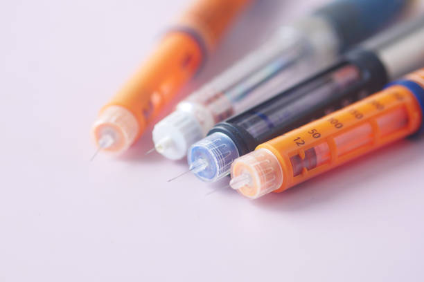 istock Insulin pens on color background, close up 1404641626