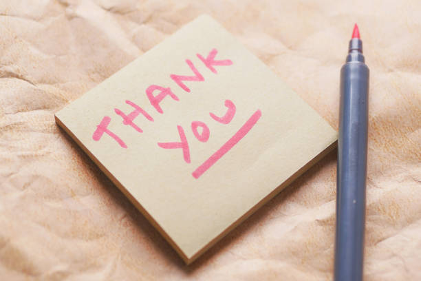 istock thank you message on a sticky note on old paper 1404642290
