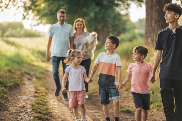 istock Big family walking in nature 1404642682