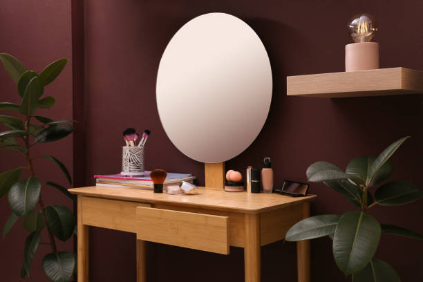 istock Wooden dressing table near brown wall in room 1404642794