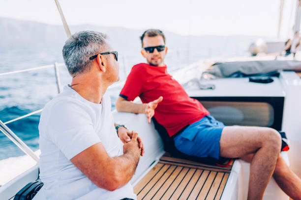 istock Crew members enjoying sailing on sailboat 1404643083