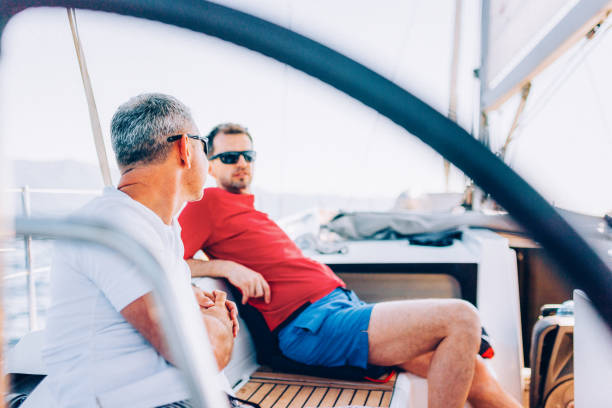 istock Crew members enjoying sailing on sailboat 1404643093
