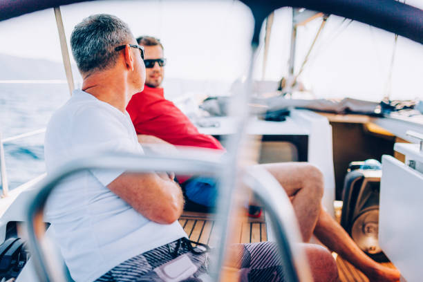 istock Crew members enjoying sailing on sailboat 1404643115