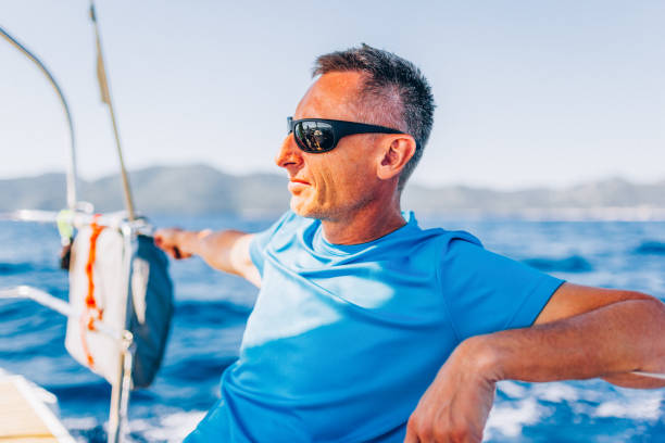 istock Crew member enjoying sailing on sailboat 1404643137