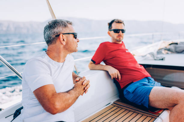 istock Crew members enjoying sailing on sailboat 1404643148