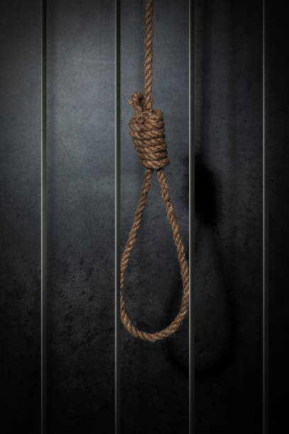 istock Rope noose with knot in prison cell 1404643404
