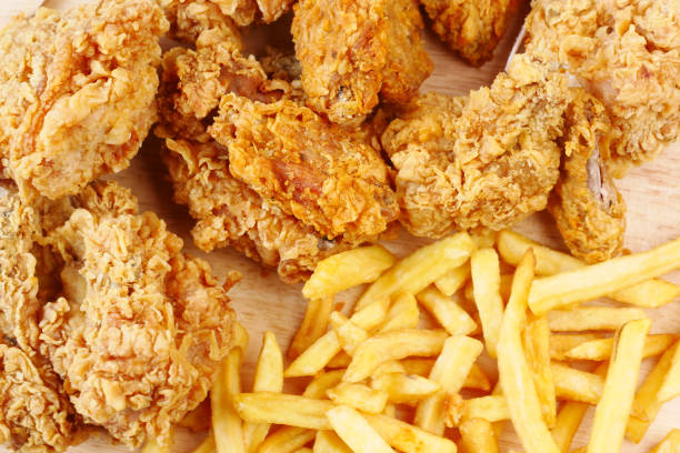 istock junk foods on plate on wooden table close up 1404644227