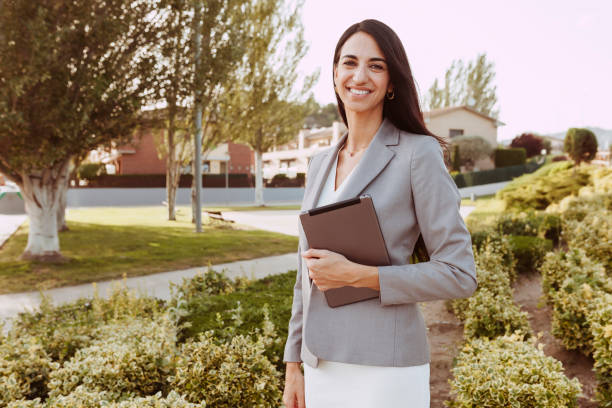 istock Urban happy business woman holding and using tablet computer and working 1404644999