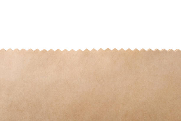 Kraft paper bag on white background, closeup Kraft paper bag on white background, closeup serrated stock pictures, royalty-free photos & images