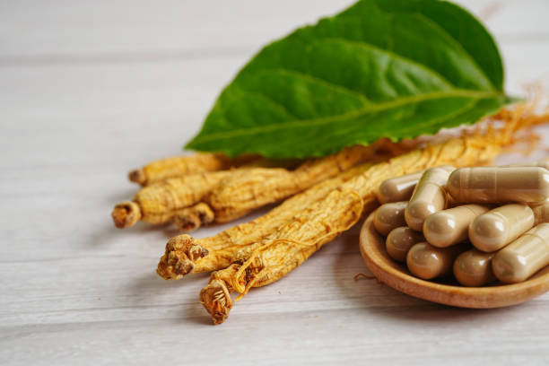 istock Ginseng roots and green leaf, healthy food. 1404645856