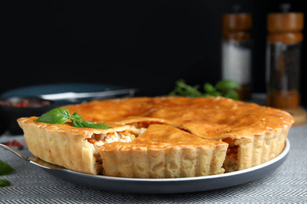 istock Delicious meat pie with basil on table, closeup. Space for text 1404647346