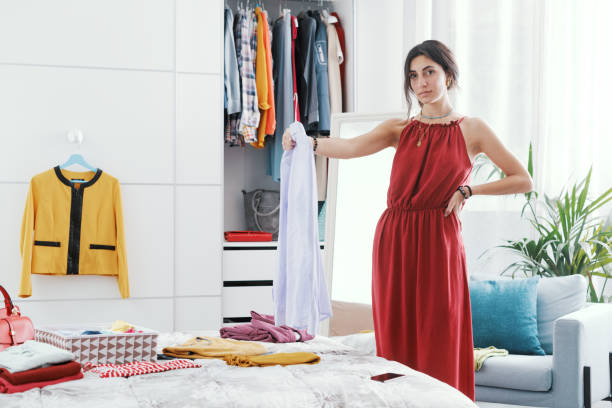 istock Woman choosing clothes in her bedroom 1404648352