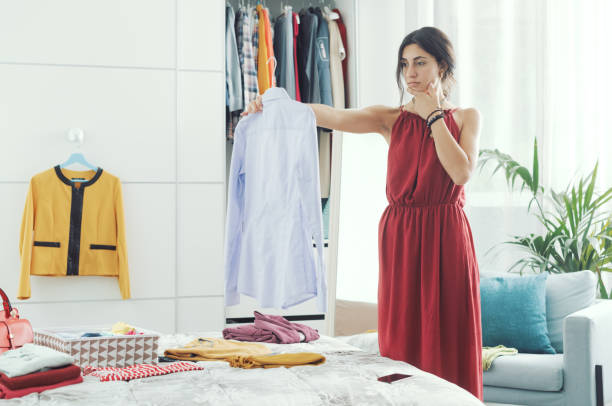 istock Woman choosing clothes in her bedroom 1404648752