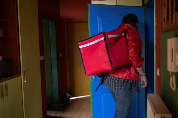 istock Male delivery person, leaving his home for work 1404649105