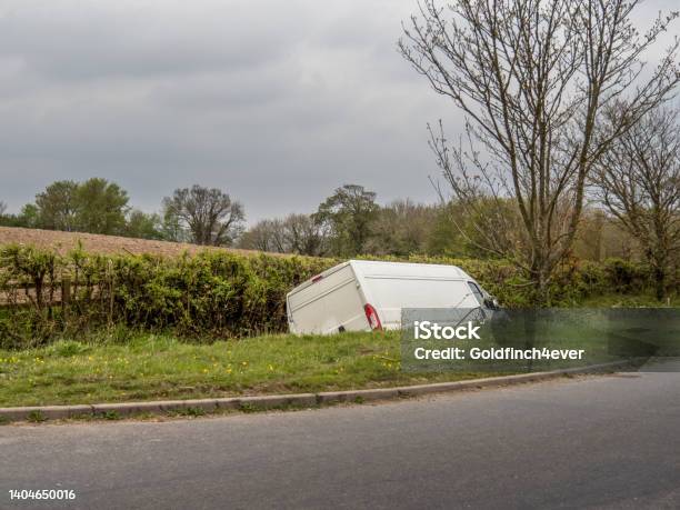 Unidentifiable White Van In Ditch Abandoned Stock Photo - Download Image Now - Van - Vehicle, Ditch, Crash