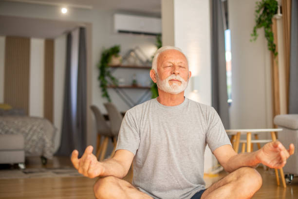 istock Senior man at home keeping fit by exercising 1404650291