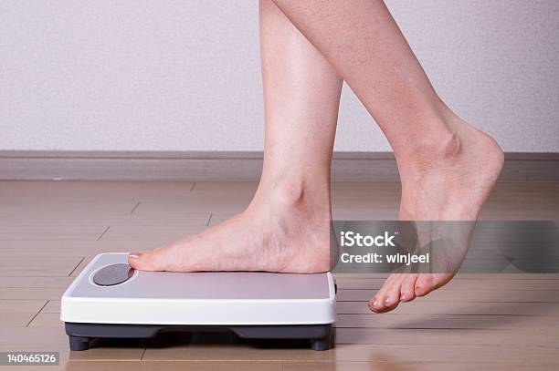 Stepping On Scales Stock Photo - Download Image Now - Adult, Ankle, Bathroom