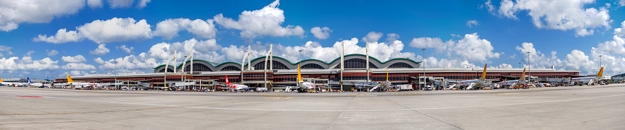 Pasay, Metro Manila, Philippines - Nov 2021: NAIA Terminal 2 airport in Manila, Philippines. View of runway, tarmac and a few airplanes.