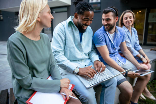 istock Young People using laptop at the College bench 1404652169