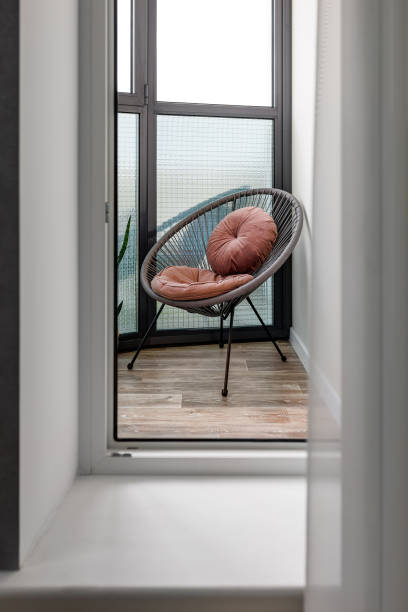 istock modern armchair standing on an open balcony 1404653450