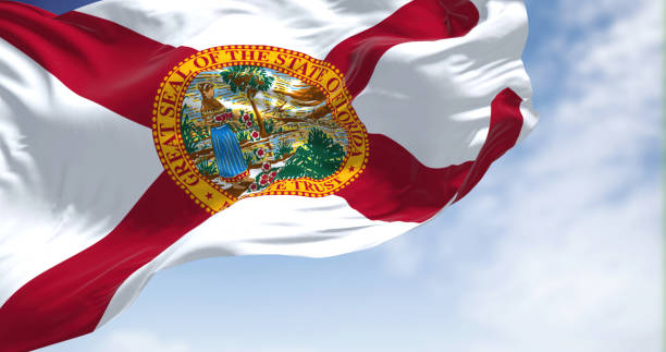 istock The Florida state flag waving in the wind on a clear day 1404655337
