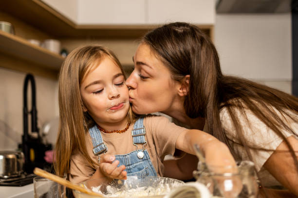 istock Mother and daughter cooking together 1404656398